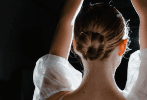 tie hair in hair bun